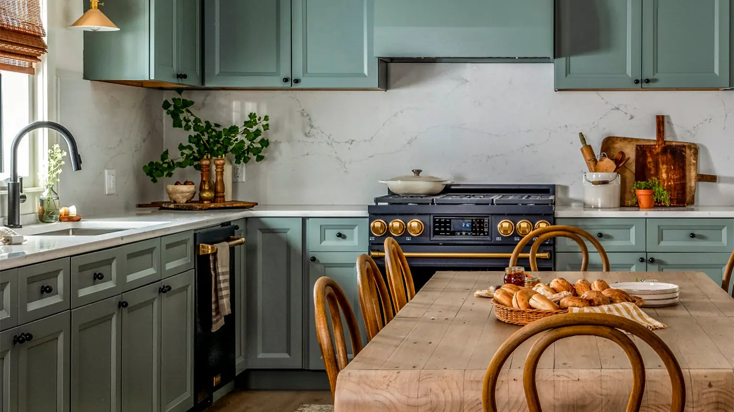 Gordon Ramsay by THOR Kitchen range in a sage green kitchen