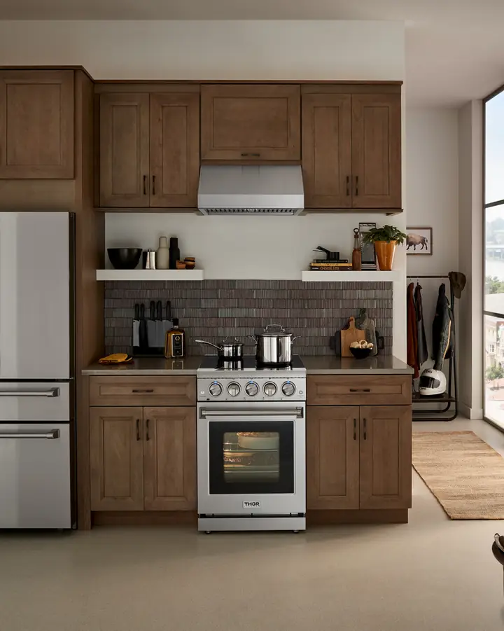 Loft kitchen with THOR Kitchen range and refrigerator