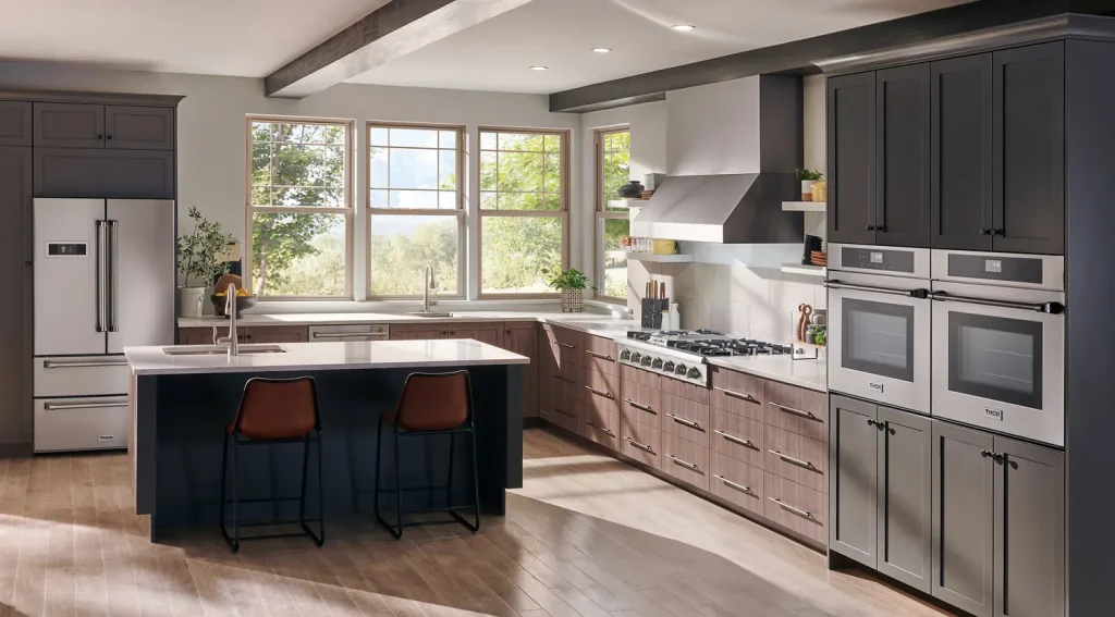 Kitchen with a THOR Kitchen professional rangetop and wall ovens