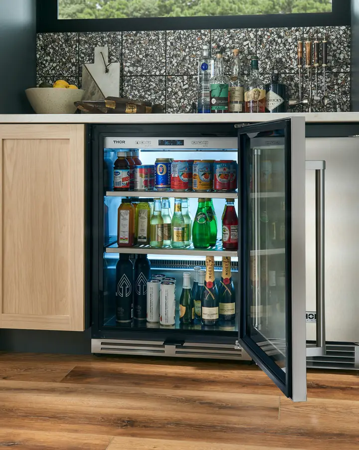 Rustic bar with a THOR Kitchen beverage cooler