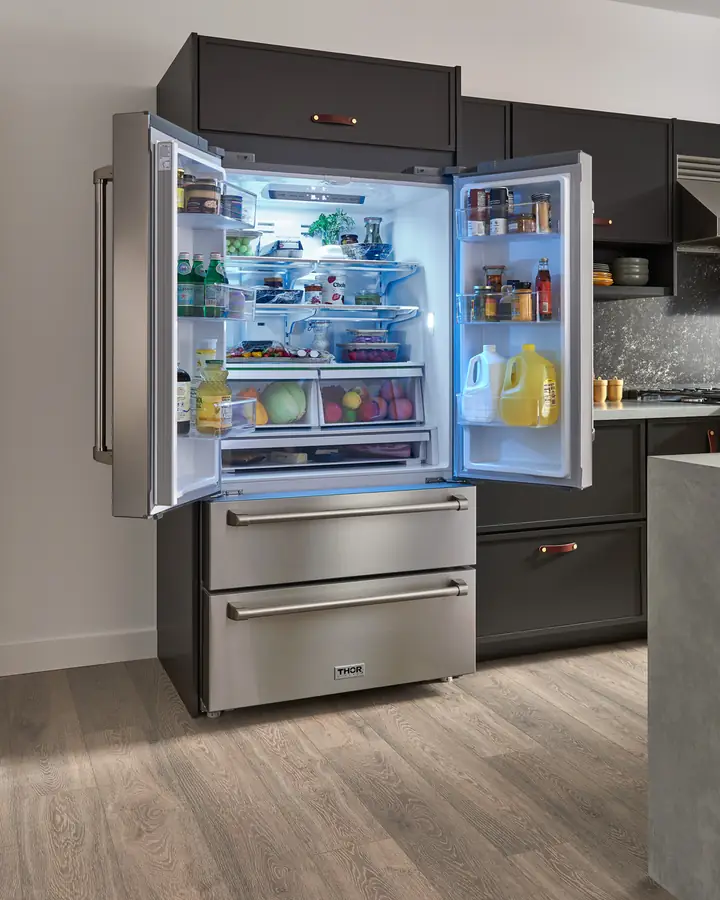 Urban kitchen with an open THOR Kitchen French door refrigerator