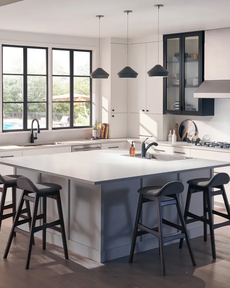 Bright white kitchen with THOR Kitchen cooktop and wall oven