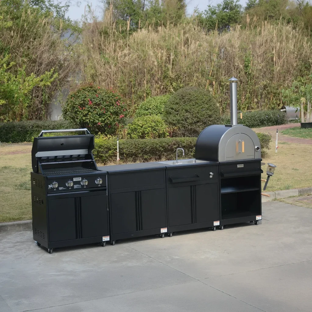 THOR Kitchen 4-piece modular outdoor kitchen island in black on a patio