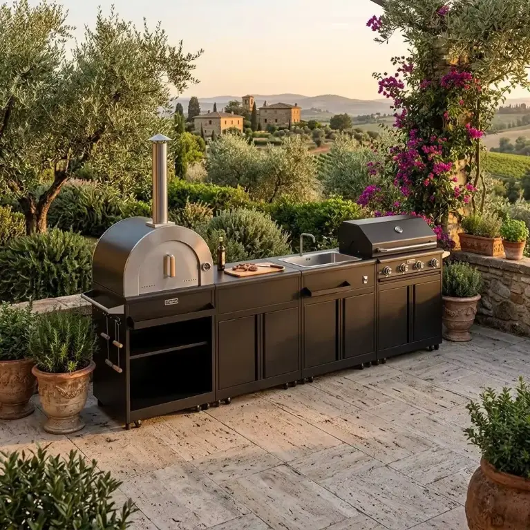 THOR Kitchen outdoor kitchen island with pizza oven in a garden